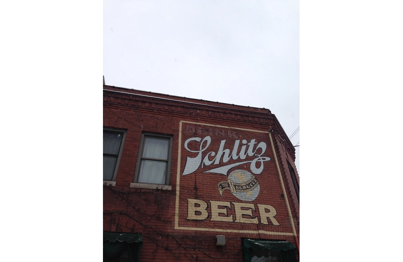 Old Schlitz Beer advertisement on a red brick building in Milwaukee Wisconsin
