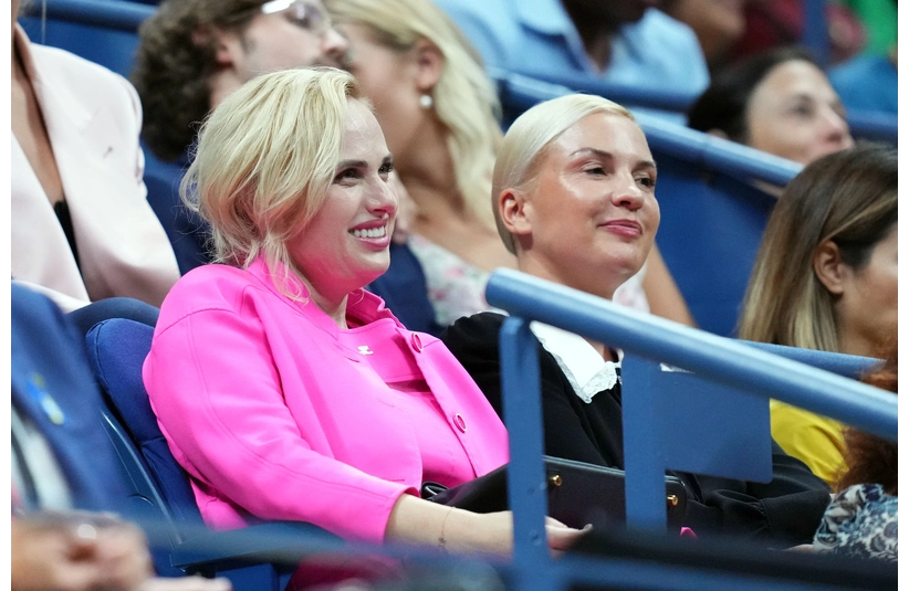 Aug 29, 2022; Flushing, NY, USA; Rebel Wilson and girlfriend Ramona Agruma watch a match between Serena Williams of the United States and Danka Kovinic of Montenegro on day one of the 2022 U.S. Open tennis tournament at USTA Billie Jean King National Tennis Center. Mandatory Credit: Danielle Parhizkaran-Imagn Images