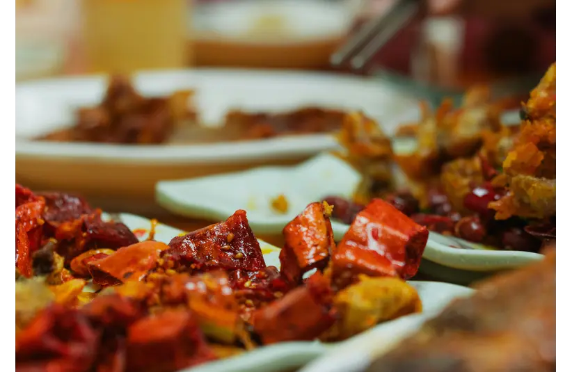 Vibrant and spicy Asian dishes featuring chili peppers, perfect for culinary enthusiasts embracing the spicy craze.