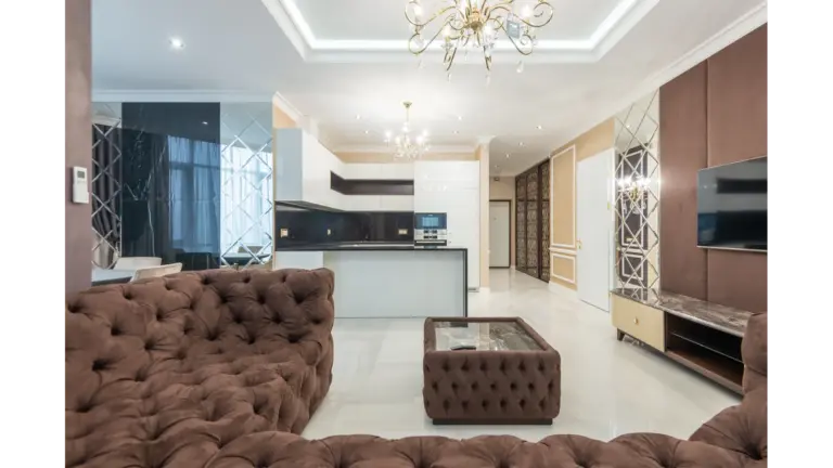 Cloud sofas bring instant cozy energy to a stylish modern living room, featuring plush furniture and elegant lighting