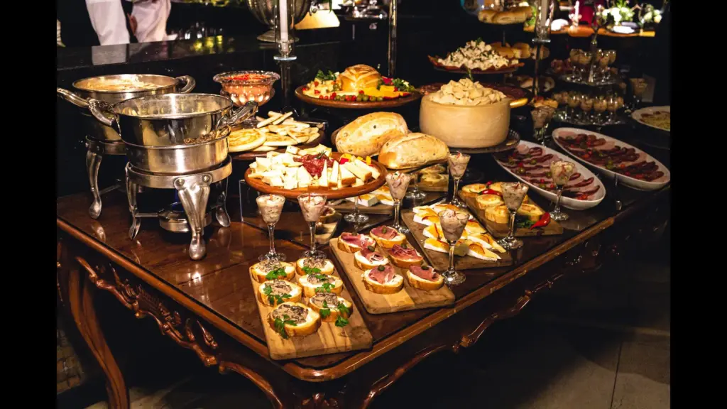 In daily devotional, a large feast is shown with food in abundance.