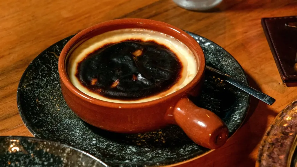 Recipe fails show up fast when you’re staring at a close‑up of a rich burnt Basque cheesecake served in a traditional ceramic dish on a wooden table.