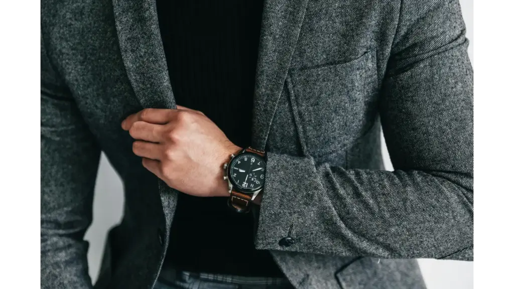 smart luxury style comes through in this close‑up of a man in a gray suit showcasing and capturing an elegant and professional fashion moment