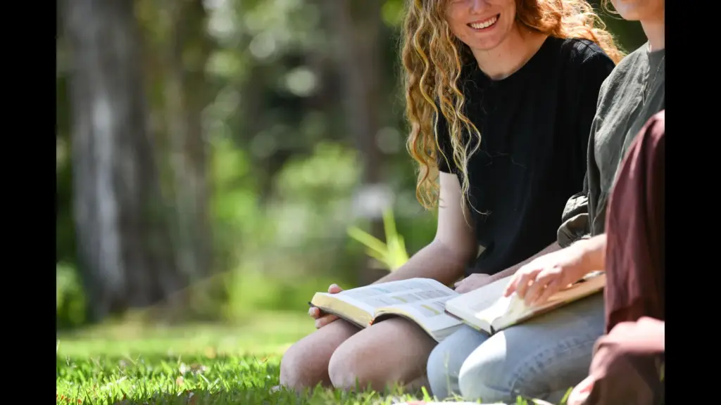 In daily devotional, a group of young adults are enjoying talking and enjoying Scripture.