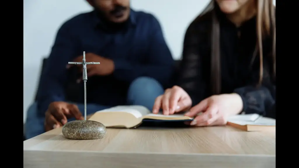 In daily devotional, a man and woman are studying the scriptures together.