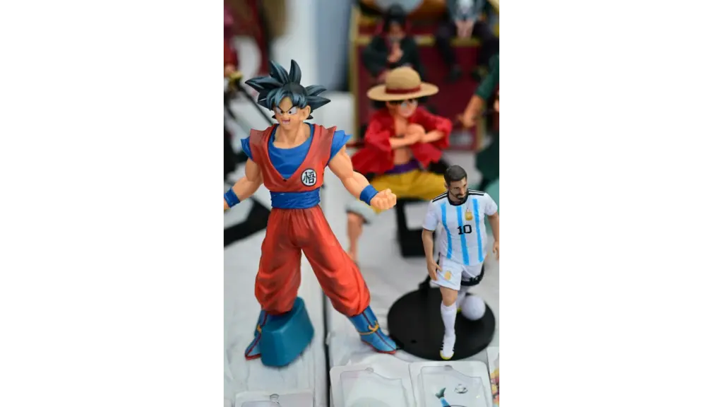 A Goku figurine stands among other anime figures as Dragon Ball Super: Beerus heads to Netflix