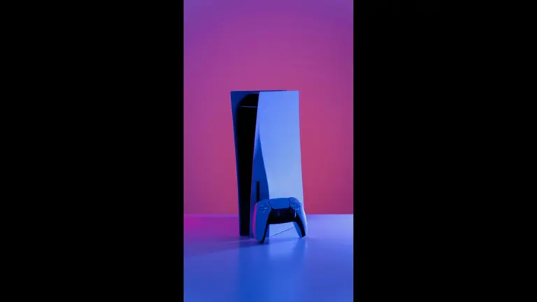 A PlayStation 5 console and controller under purple lighting, the system for the PS Plus October 2026 free games.