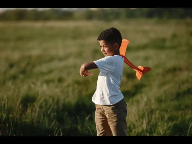 In daily devotional, a young boy is seen  playing with a toy. just as Isaac, son of Abraham, would have played at that age.