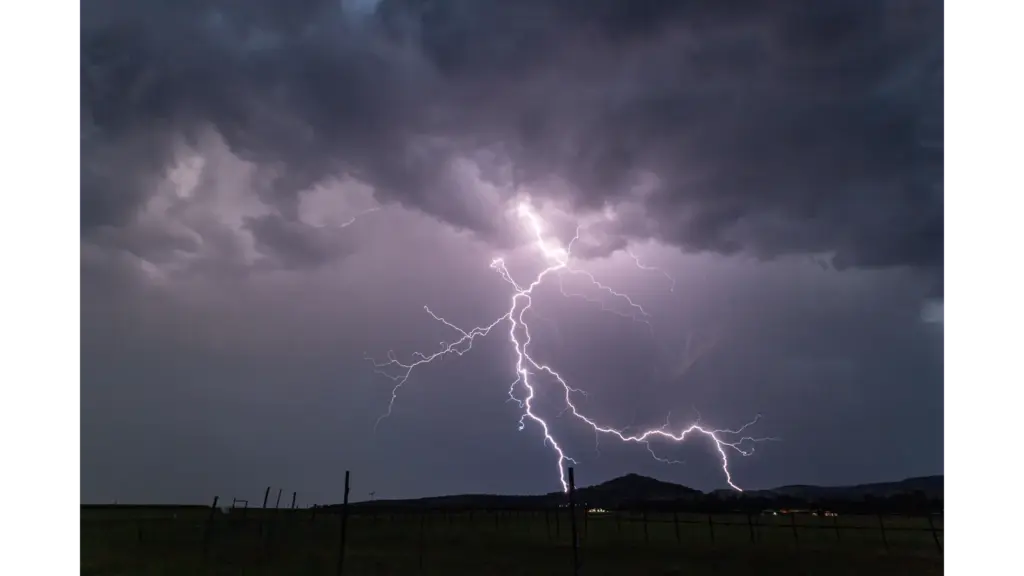 Stunning capture of a powerful lightning storm, glowing with raw atmospheric energy that mirrors the intense, instinctive pull of weather intuition.