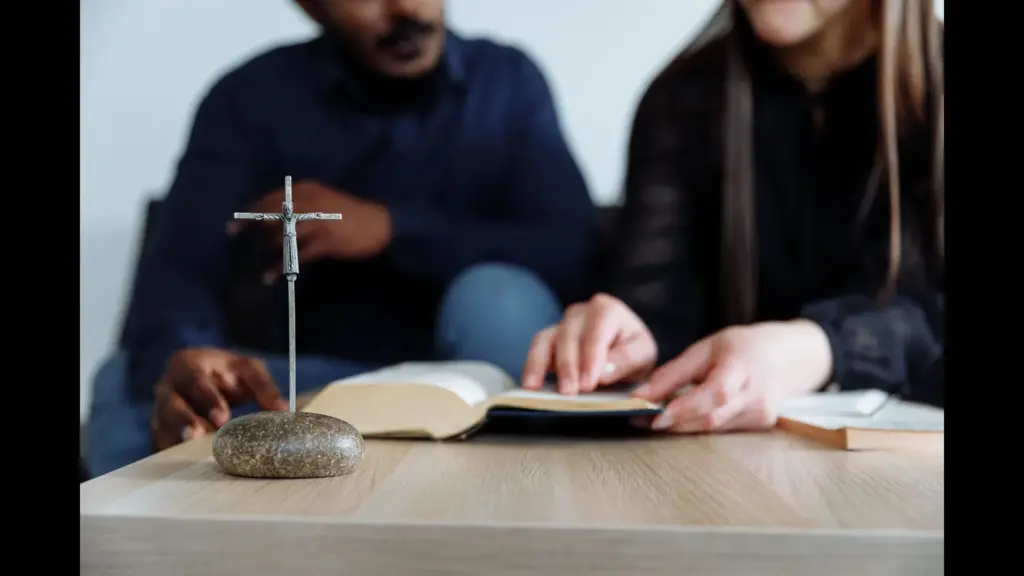 In daily devotional, two people study God's word together.