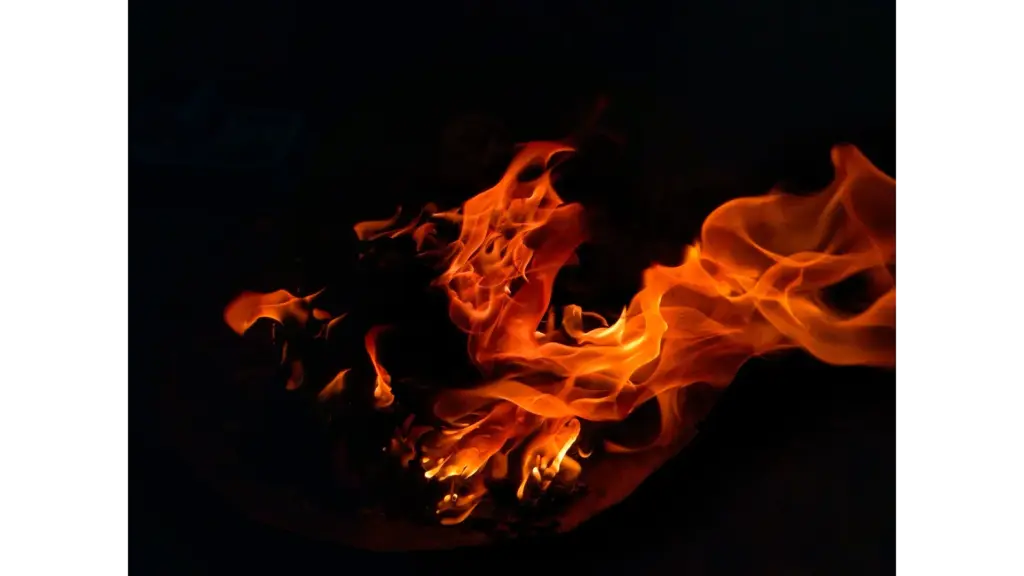 A mesmerizing view of flames dancing in the dark, creating warmth and light, echoing the surreal intensity of fire dreams.