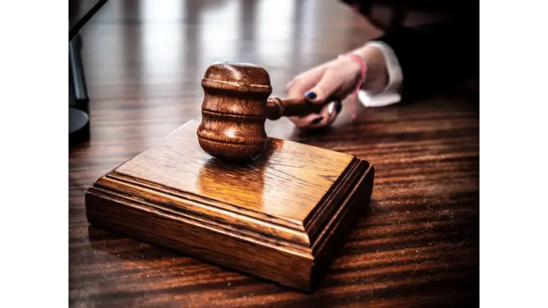 Close-up of a wooden gavel on a judge's desk, symbolizing justice for Jay Lee, gaming companies, court, law suit, Evolutions festival