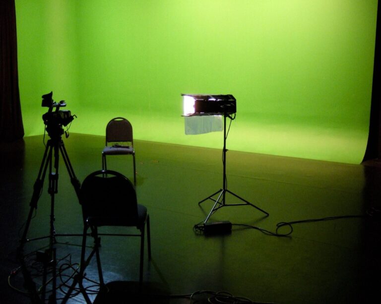 Green screen studio with a camera and lights, the kind of set where Apple Studios VFX crews work