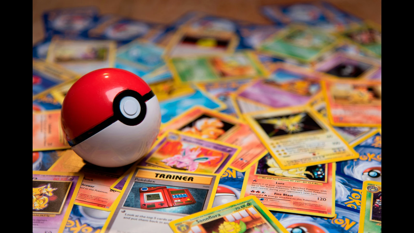 Pokémon cards and a Poké Ball illustrating Pokémon Prime deals