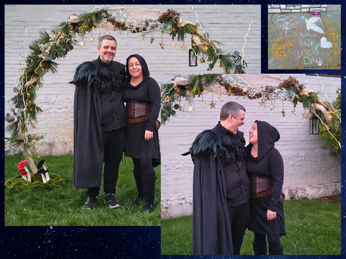A couple dressed in dark, fantasy-style costumes stands under a decorative archway adorned with greenery and lights. The woman is wearing a hooded cloak and has a playful expression as she leans toward the man, who is wearing a black cape with feathers. Inset images show them in similar attire, with one featuring a stone surface with colorful chalk drawings. 