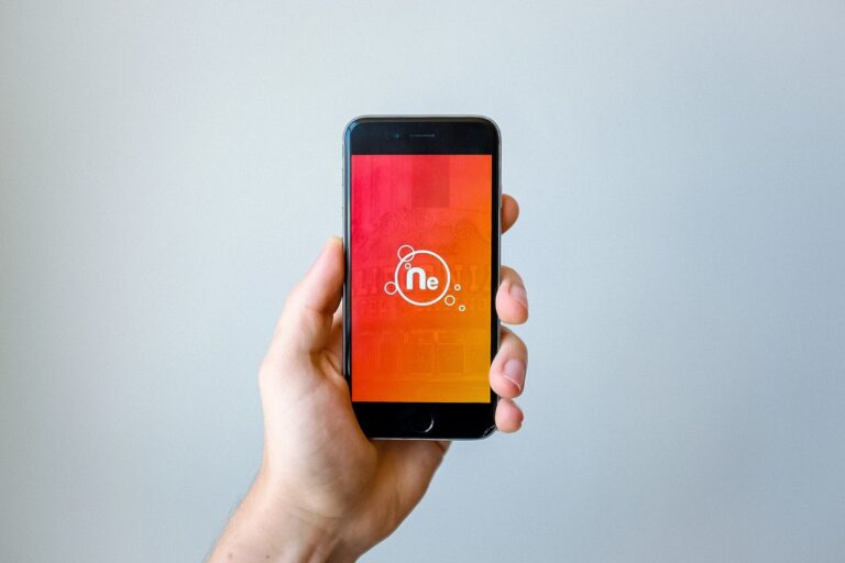 A hand holding a smartphone, a stand-in image for the Animula Nook mobile game