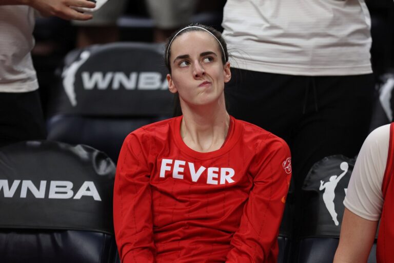 Caitlin Clark, whose Nike Caitlin Clark shoe launched Oct. 1, stands on the Indiana Fever sideline in 2024