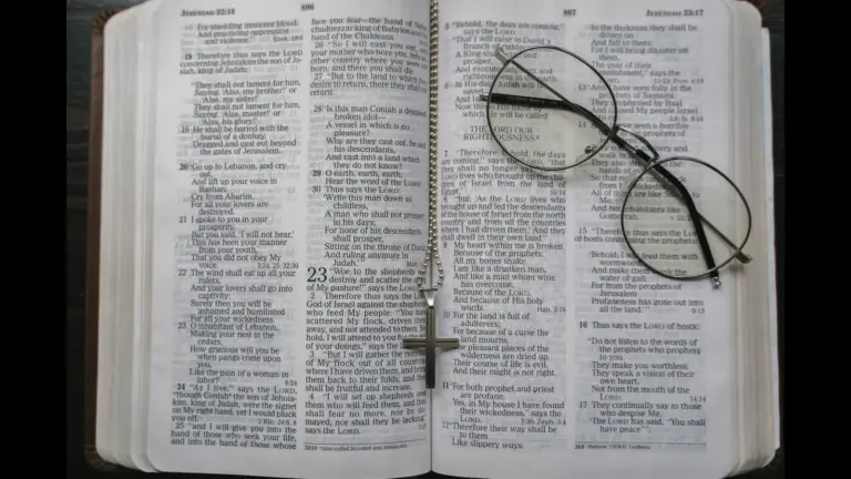 In Wednesday's daily devotional, an open Bible has eyeglasses and a cross on it.