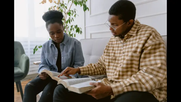 In Monday's devotional, a man and woman sit together and study the Bible.